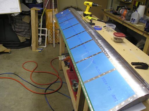 Installing rivets in trailing edge