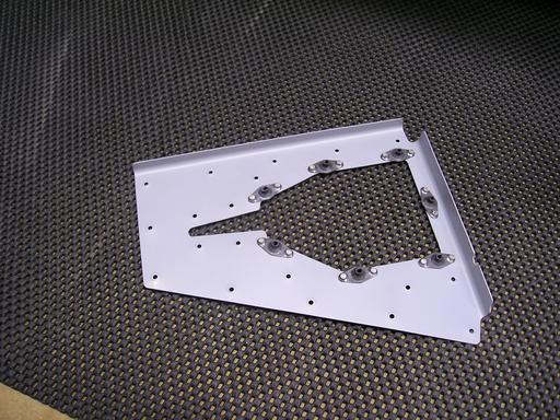 Nutplates on trim motor access panel cutout