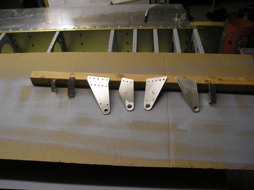 Aileron hinge parts drilled, cleaned, deburred