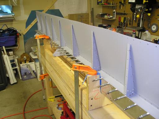 Rivet upper skin to assembly