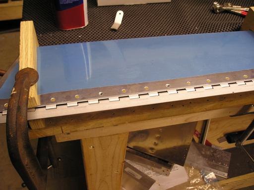 Riveting spar to trim tab