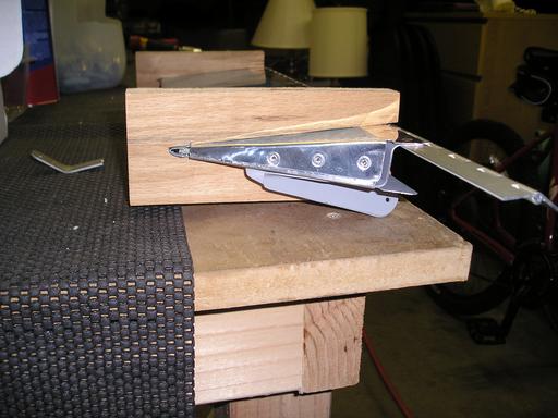 Blind rivets in ends of trim tab