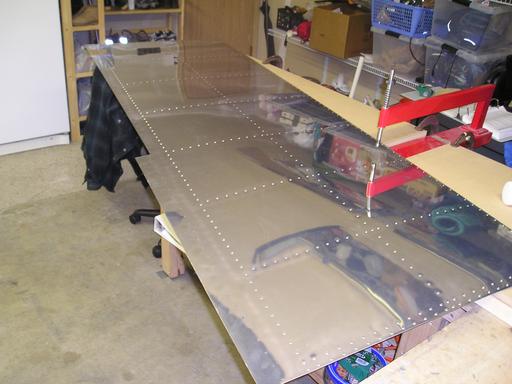 Dimpling an upper skin