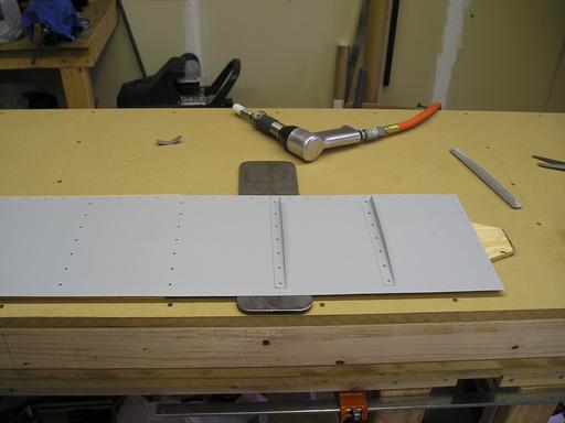 Riveting stiffener to skin