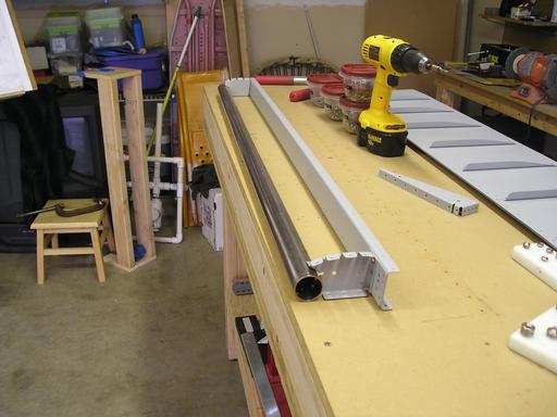 Riveted counterbalance assembly to spar
