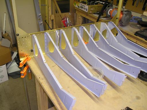 Riveting seat ribs