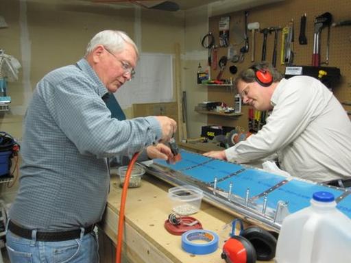Riveting the lower skin to spar