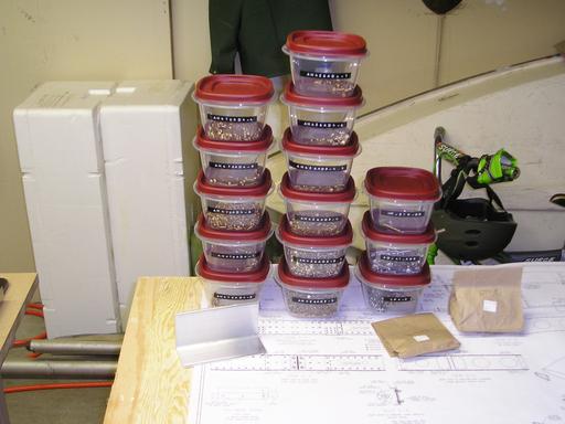 Fasteners in their containers
