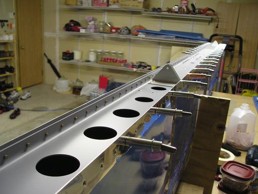 Riveting rear spar to skin