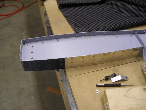 Skin riveted to counterbalance ribs