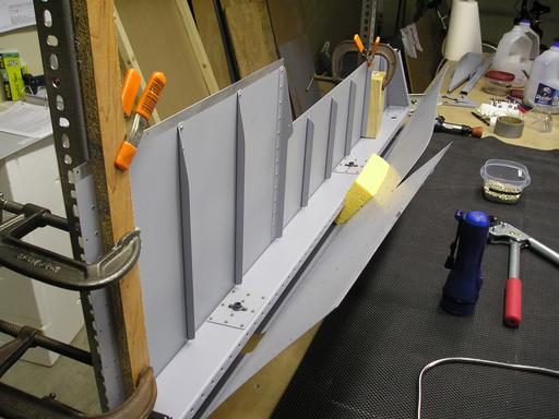 Top of spar and skin riveting continued