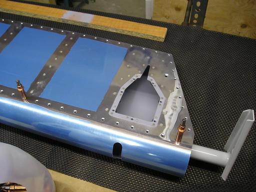 Riveting bottom trim panel reinforcement