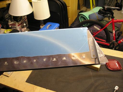Finished rivets on bottom of trim tab