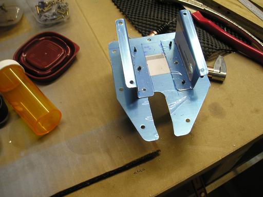 Fitting servo brackets to access door