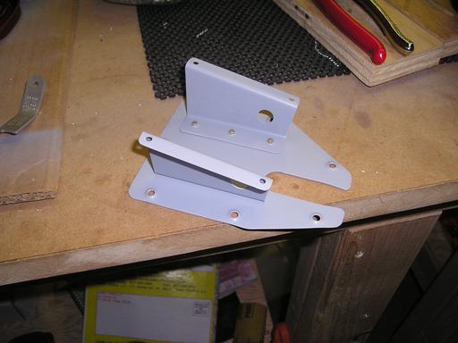 Riveted brackets to door
