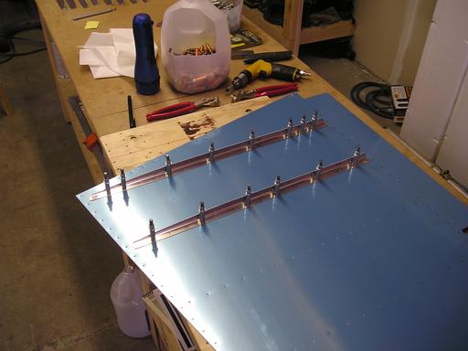 Drilling rudder skin stiffeners