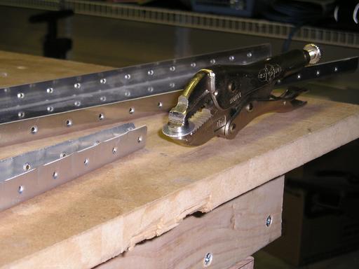 Dimpling rudder rib