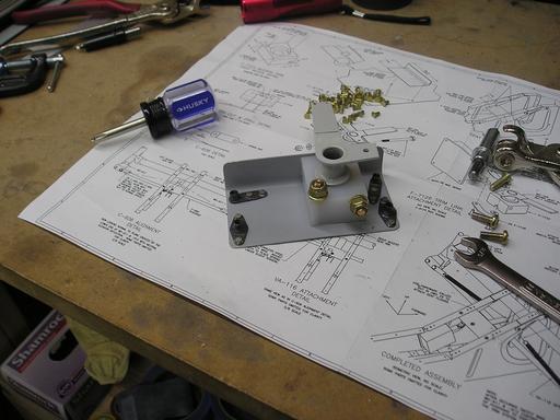Assembled trim arm and bracket