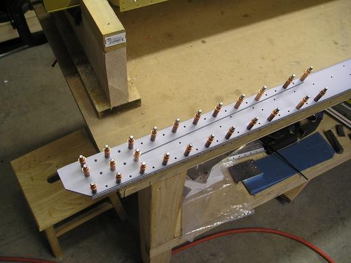 Inboard end of rear spar