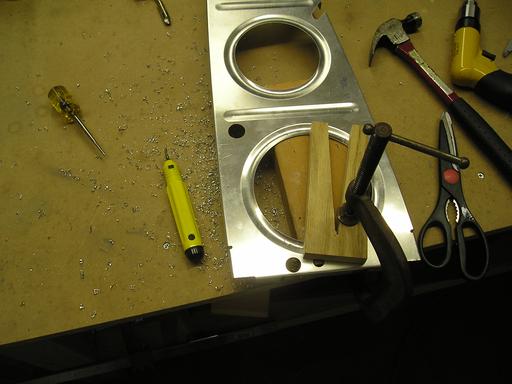 Drilling conduit holes in ribs