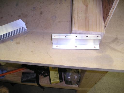 Drilled and deburred tank attach angle