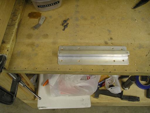 Drilled tie-down bracket