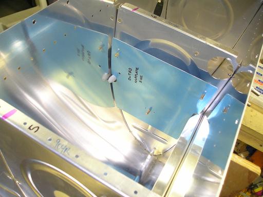 Fitting outboard cap plate
