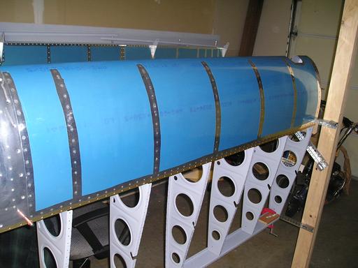 Riveting leading edge to spar